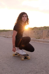 portrait of a teenager skater girl at the city