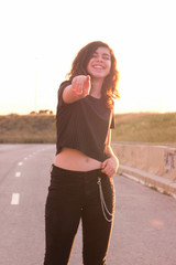 portrait of a teenager skater girl at the city