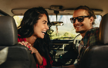 Happy couple on road trip