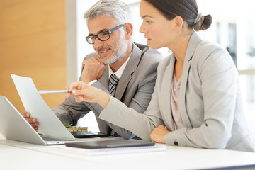 Corporate business coleagues working together in modern office