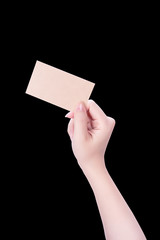 Young asia clean girl hand holding a blank kraft brown paper card template isolated on black background, clipping path, close up, mock up, cut out