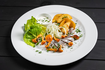 herring with baked potato and sauce