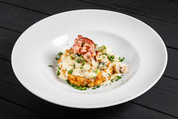 potato pancakes with bacon and sauce