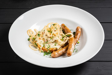 potato pancakes with sausages and fried onion