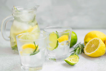 Lime, lemon , rosemary lemonade with ice cubes, refreshing summer drink