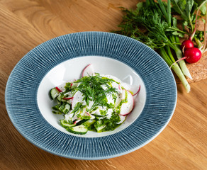summer fresh salad with radishesa and cucumber