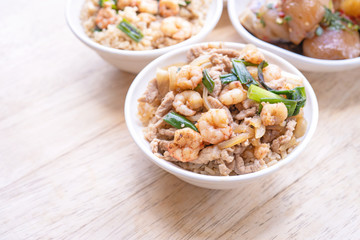 Braised shrimp over rice - Taiwan famous traditional street food. Soy-stewed prawn on cooked rice. Travel concept, top view, copy space, close up