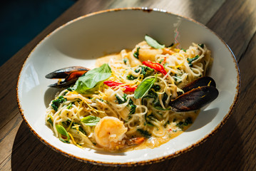 seafood pasta on the wooden background