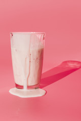 Glass with spilled milkshake