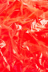 Abstract plastic texture on bright pink background as symbol of a major environmental problem. Ecology concept.
