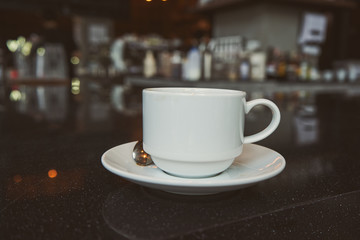    Cup of coffee top on the bar table