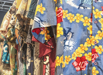 Milan - Italy. Hawaiian shirts with flowers and surf scenes, ideal for wearing on the beach.For...