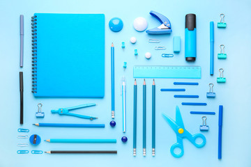 Set of school supplies on color background