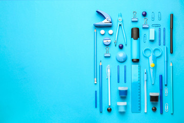 Set of school supplies on color background