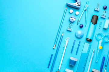 Set of school supplies on color background