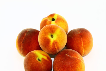Six healthy and tasty peaches on a white background