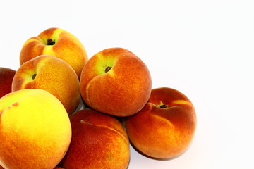 Fresh and juicy peaches on white background