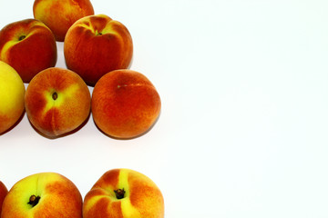 Eight sweet peaches on a white background