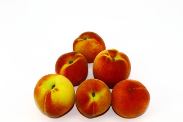 Six peaches on a white background
