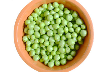 juicy peas in an orange Cup on a white background isolate