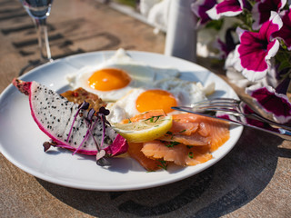 Elegant tasteful summer breakfast table outdoor.