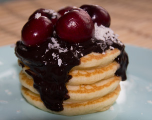 Pancake with chocolate cream and cherry