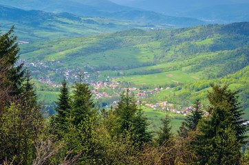 Beautiful spring green landscape. View of the charming villages in the mountains.