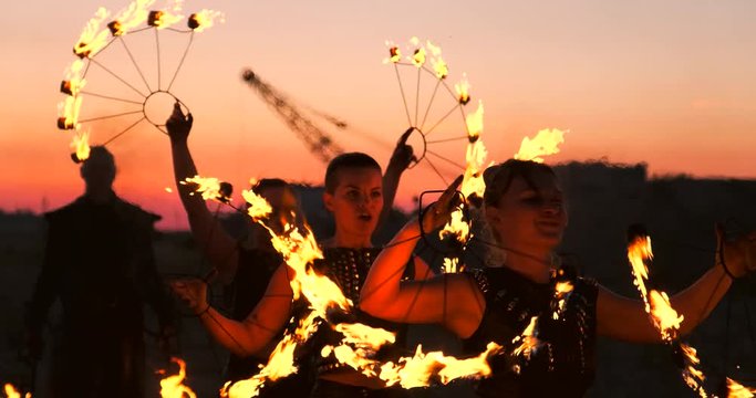 Fire show artist breathe fire in the dark at abandon building, slow motion. Fire in heart shape