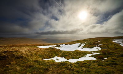 Views across the Yorkshire Dales from below the summit of Ingleborough in winter.