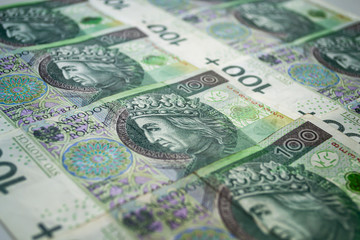 Polish zloty banknotes background. One hundred zloty banknotes.