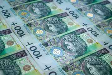 Fototapeta na wymiar Polish zloty banknotes background. One hundred zloty pattern