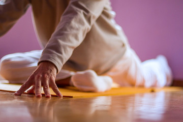 Yoga class, close up of male practising Pigeon Pose (Eka Pada Rajakapotasana).