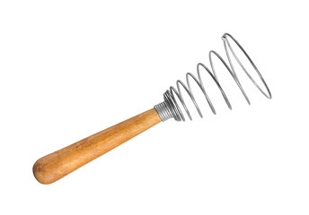 Vintage kitchen whisk on an isolated white background