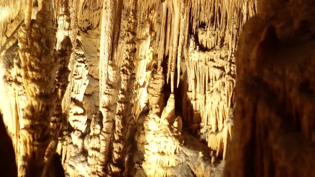 Dolly or track left of stalagtites and stalagmites in Drach Caves, Mallorca island, Spain