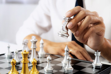business man leadership playing chess board, risk and strategy, investment concept.