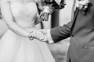 black and white photo of wedding rings