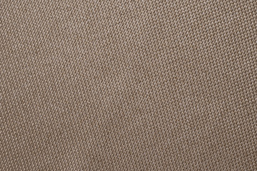 Brown fabric texture of sackcloth. Clothing background. Cloth backdrop. Pattern of sacking, bagging. Linen fabric surface close-up.