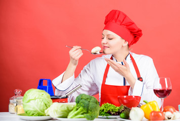 organic eating and vegetarian. Housewife. happy woman cooking healthy food by recipe. restaurant menu. Dieting. professional chef on red background. woman in cook hat. Culinary recipe