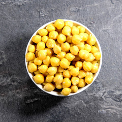Bowl of Uncooked Chickpeas On A Table Top