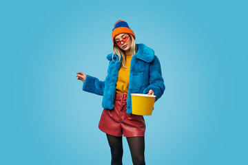 Strange woman with bucket of popcorn