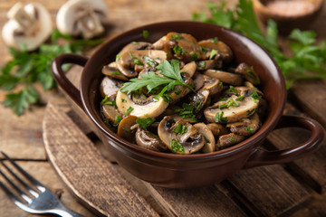 fried champignon mushrooms with gurlic and parsley