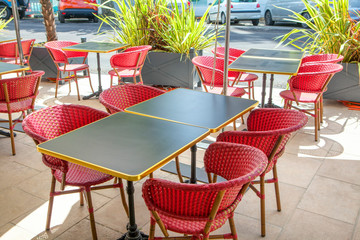 summer terrace with red chairs 