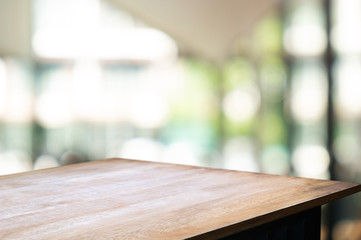 empty wood table with blur montage restaurant background