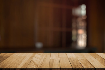 empty wood table with blur montage restaurant background