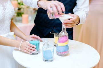 Newlyweds during sand ceremony