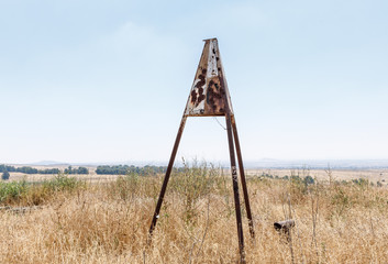 Naklejka premium Hopper designation with bullet holes that has remained since the War of the Doomsday (Yom Kippur War) on the Golan Heights in Israel