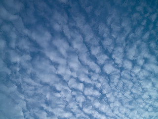 Summer blue sky with white light clouds.