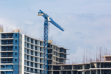 Tower crane at the construction site of a multistory building