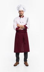 Positive handsome chef cook in beret and white outfit isolated on white background.