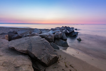 rocks in sea at sunrise